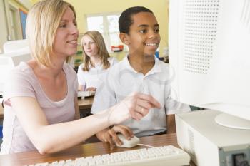 Royalty Free Photo of a Student and Teacher at a Computer