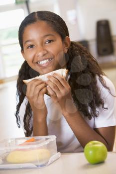 Royalty Free Photo of a Student Eating Her Lunch