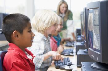 Royalty Free Photo of Children at Computers