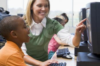 Royalty Free Photo of a Teacher Helping a Student