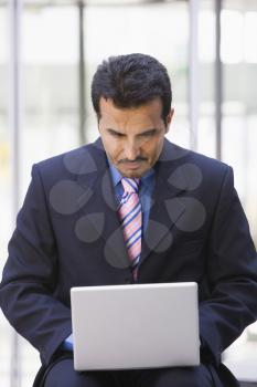 Royalty Free Photo of a Man With a Laptop