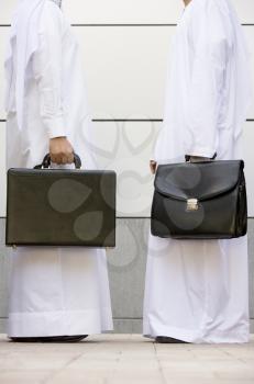 Royalty Free Photo of Two Eastern Businessmen With Briefcases
