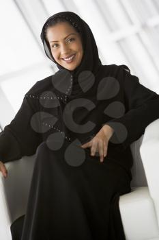 Royalty Free Photo of a Woman Sitting Indoors