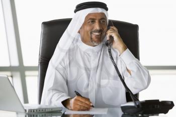 Royalty Free Photo of an Eastern Man on a Telephone
