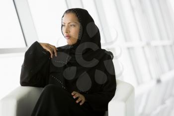 Royalty Free Photo of an Eastern Woman in a Chair