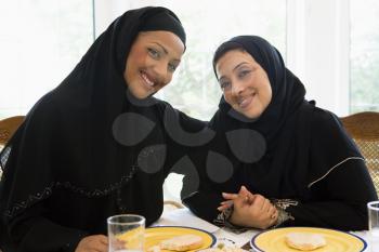 Royalty Free Photo of Two Women at a Table