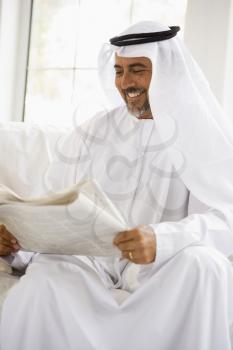 Royalty Free Photo of a Man Reading the Paper
