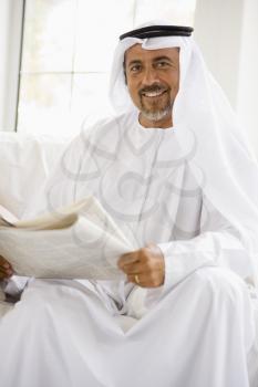 Royalty Free Photo of a Man Reading a Newspaper