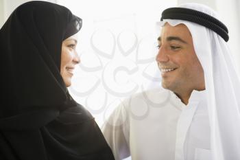 Royalty Free Photo of a Couple Smiling at Each Other
