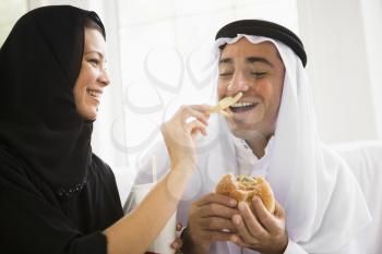 Royalty Free Photo of a Couple Eating Fast Food