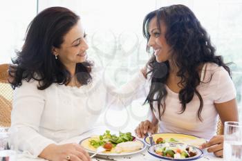 Royalty Free Photo of Two Women at a Dinner Table