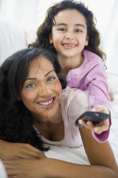 Royalty Free Photo of a Mother and Daughter With a Remote