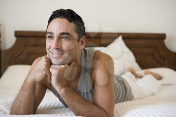 Royalty Free Photo of a Man on His Bed