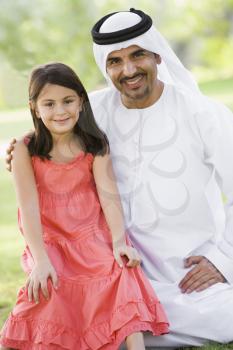 Royalty Free Photo of a Man and Daughter Outside