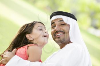 Royalty Free Photo of a Young Girl and Her Father Outside
