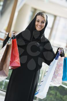 Royalty Free Photo of a Woman Showing Her Purchases at the Mall