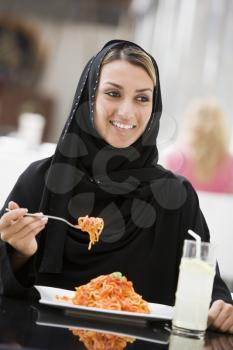 Royalty Free Photo of a Woman Eating Spaghetti