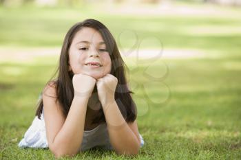 Royalty Free Photo of a Girl on the Lawn