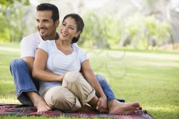 Royalty Free Photo of a Couple Sitting on the Lawn