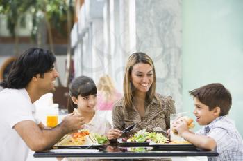 Royalty Free Photo of a Family Eating Out
