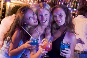 Royalty Free Photo of Young Women With Drinks in a Bar