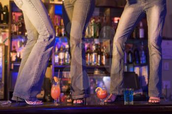 Royalty Free Photo of People Dancing on a Bar
