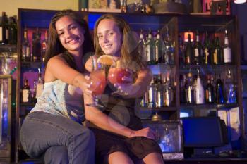 Royalty Free Photo of Young Women at a Bar