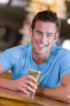 Royalty Free Photo of a Man with a Glass of Beer