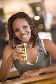Royalty Free Photo of a Woman Having a Beer