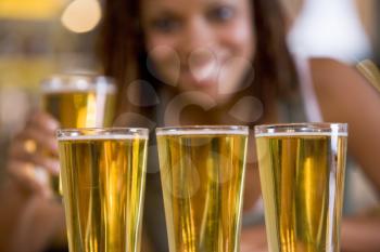 Royalty Free Photo of a Woman With Several Beer Glasses