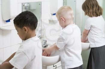 Royalty Free Photo of Students Washing Their Hands