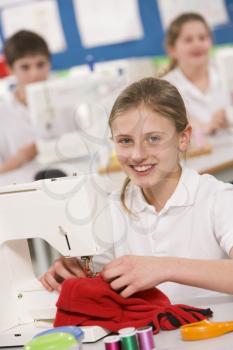 Royalty Free Photo of a Girl Sewing