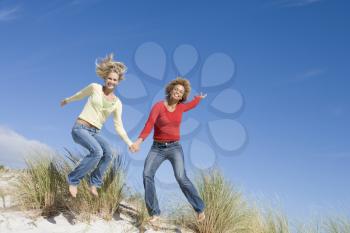 Royalty Free Photo of Two Women Jumping