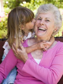 Royalty Free Photo of a Little Girl Kissing Her Grandma