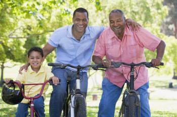 Royalty Free Photo of Three Generations on Bikes