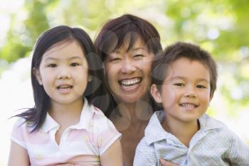 Royalty Free Photo of a Woman With Her Grandchildren