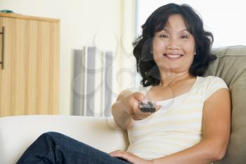 Royalty Free Photo of a Woman With a Remote