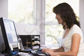 Royalty Free Photo of a Woman at the Computer