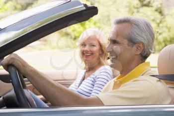 Royalty Free Photo of a Couple in a Convertible