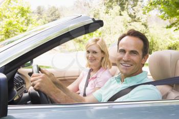 Royalty Free Photo of a Couple in a Convertible
