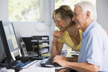 Royalty Free Photo of a Couple at the Computer