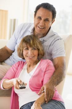Royalty Free Photo of a Couple With the Remote