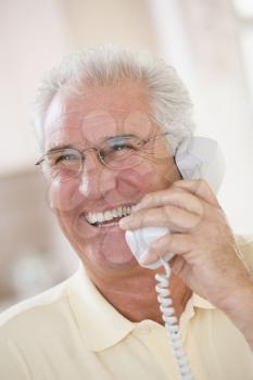 Royalty Free Photo of a Man Laughing on the Phone