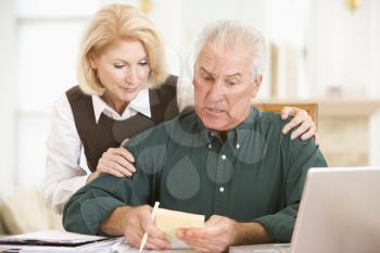 Royalty Free Photo of a Couple Looking at Paperwork