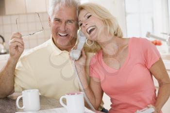 Royalty Free Photo of a Couple Talking on the Phone