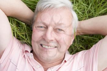 Royalty Free Photo of a Man Lying in the Grass