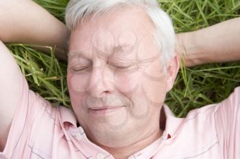 Royalty Free Photo of a Man Lying on the Grass