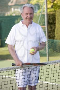 Royalty Free Photo of a Man Ready to Play Tennis
