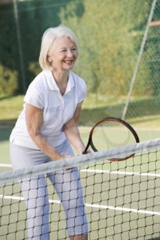 Royalty Free Photo of a Woman Playing Tennis