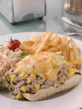 Royalty Free Photo of an Open Tuna and Sweet Corn Melt with Coleslaw and Fries